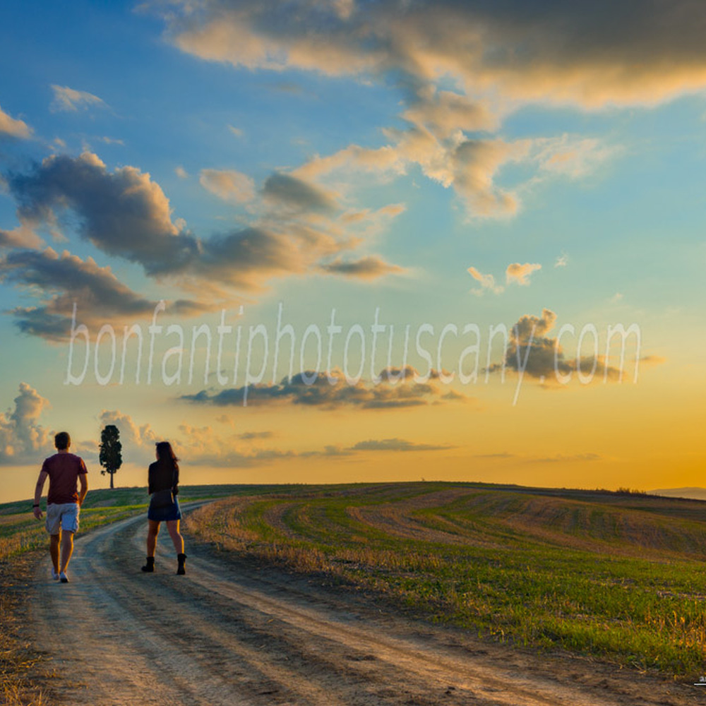 crete senesi landscape #89 country road with two hikers in mucigliani