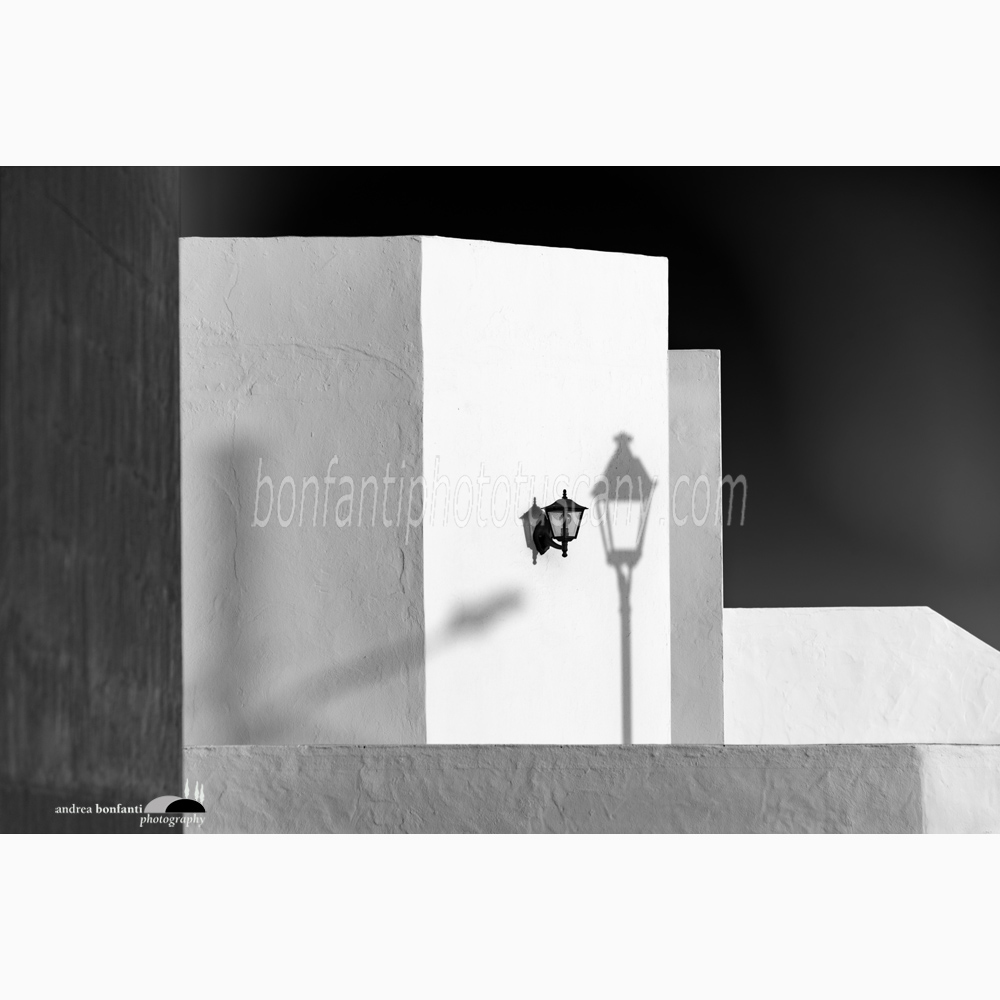 traditional architecture in Teguise with a street lamp shadow.jpg