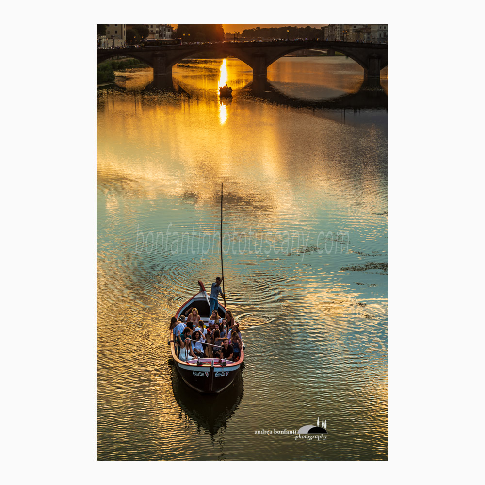 a renaiolo on the river arno at sunset.jpg