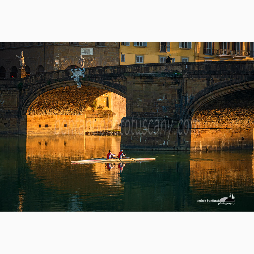 two early riser canoeists under the ponte santa trinita in florence.jpg