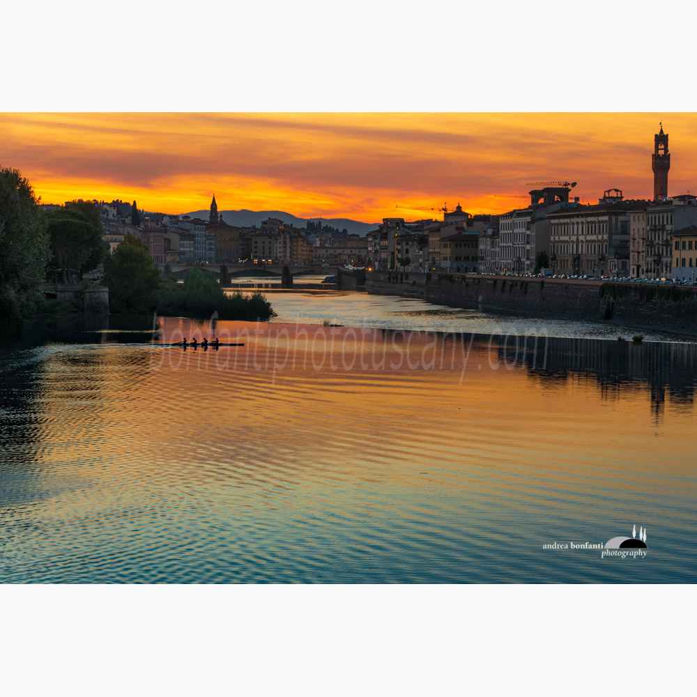 a canoe at sunset and florence skyline.jpg