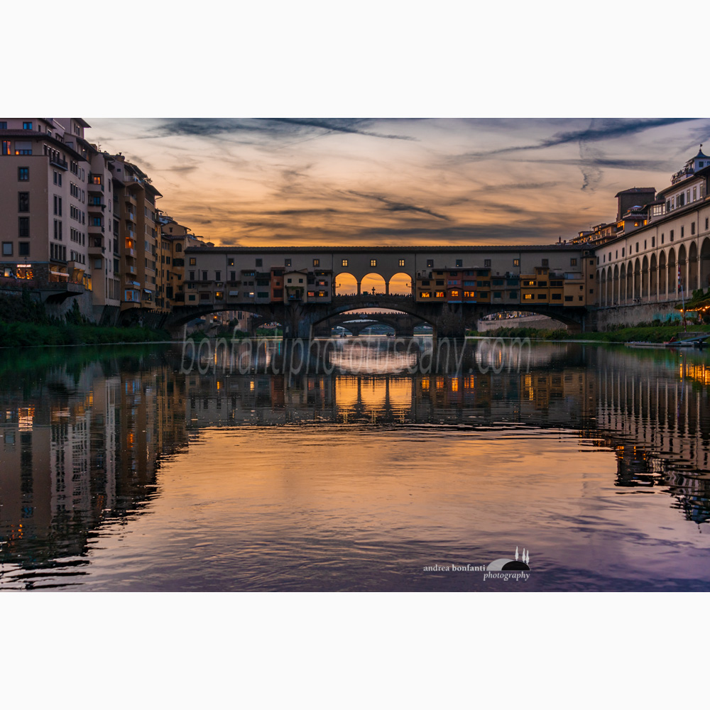 ponte vecchio with purple reflections on the water shot from arnoboat.jpg