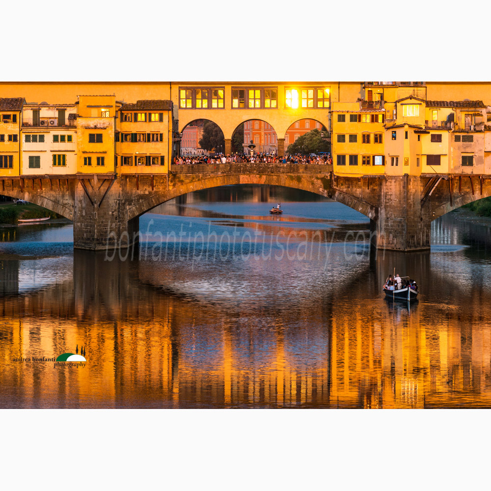 a warm sunset over the river arno and ponte vecchio.jpg