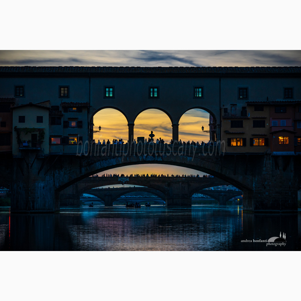 a low key image of ponte vecchio shot from arnoaboat.jpg