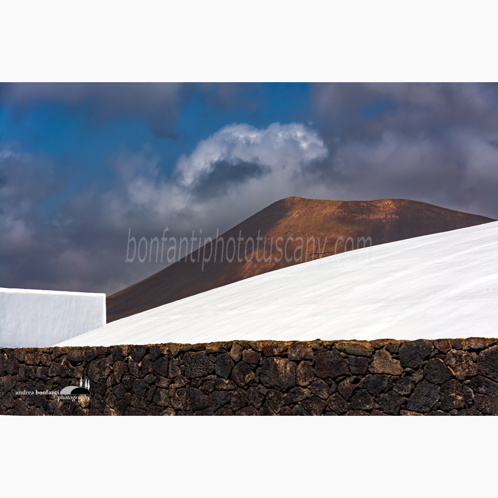 low-rise buildings and a volcano at Campesino monument.jpg