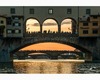 the bridges of florence seen from the little boat of a renaiolo
